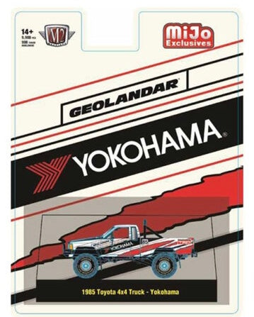 M2 Machines 1:64 1985 Toyota 4×4 Off-Road Pickup Yokohama Geolandar – White – MiJo Exclusives